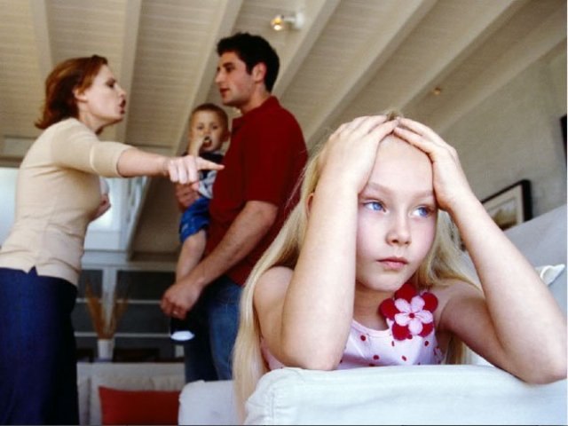 Parents arguing sad children